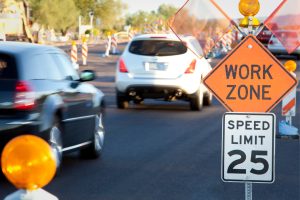 cars driving by work zone with 25 mph speed zone