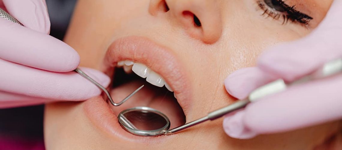 woman getting teeth prepped for dental implants