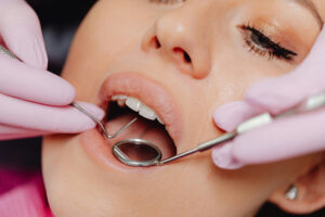 woman getting teeth prepped for dental implants